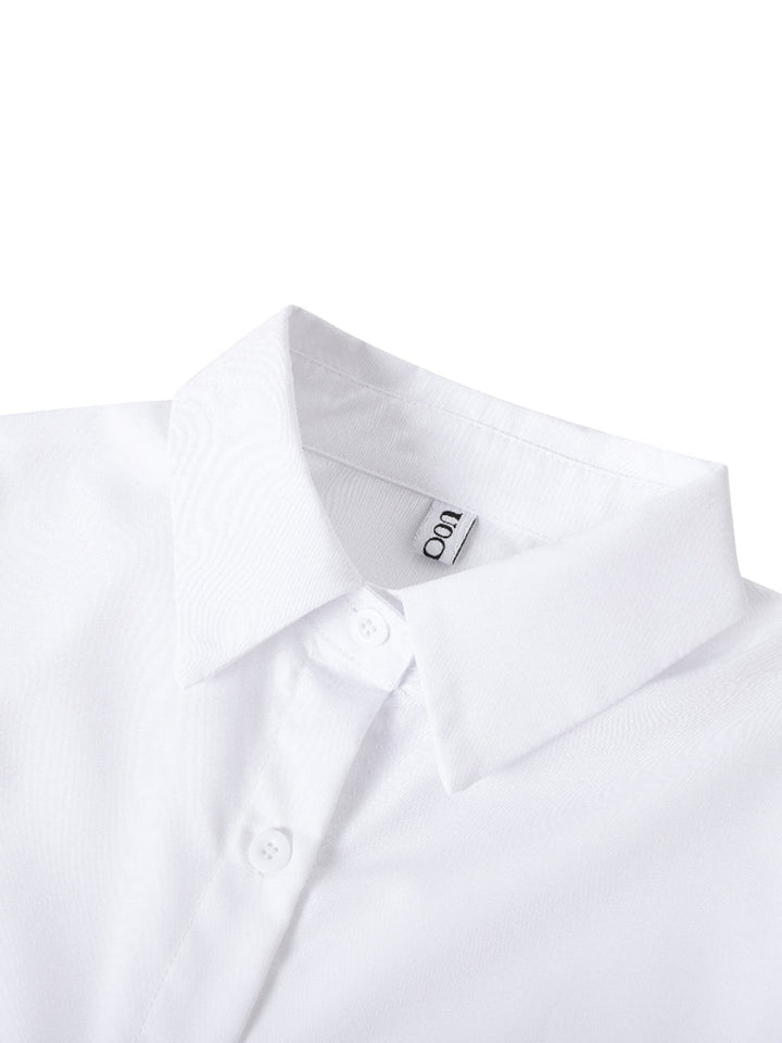 Fashionable women's button up blouse, featuring tiered design & charming ruffle cuffs.