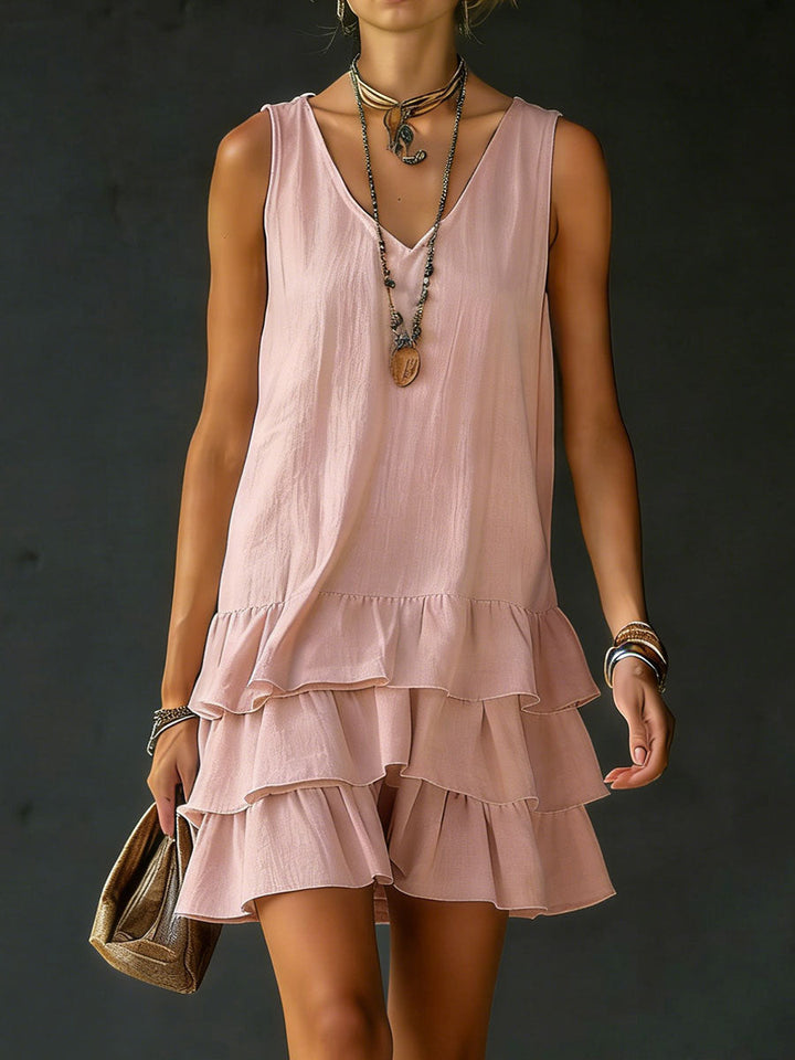 Stylish women's mini dress featuring tiered ruffles, sleeveless design, and a flattering V-neck.