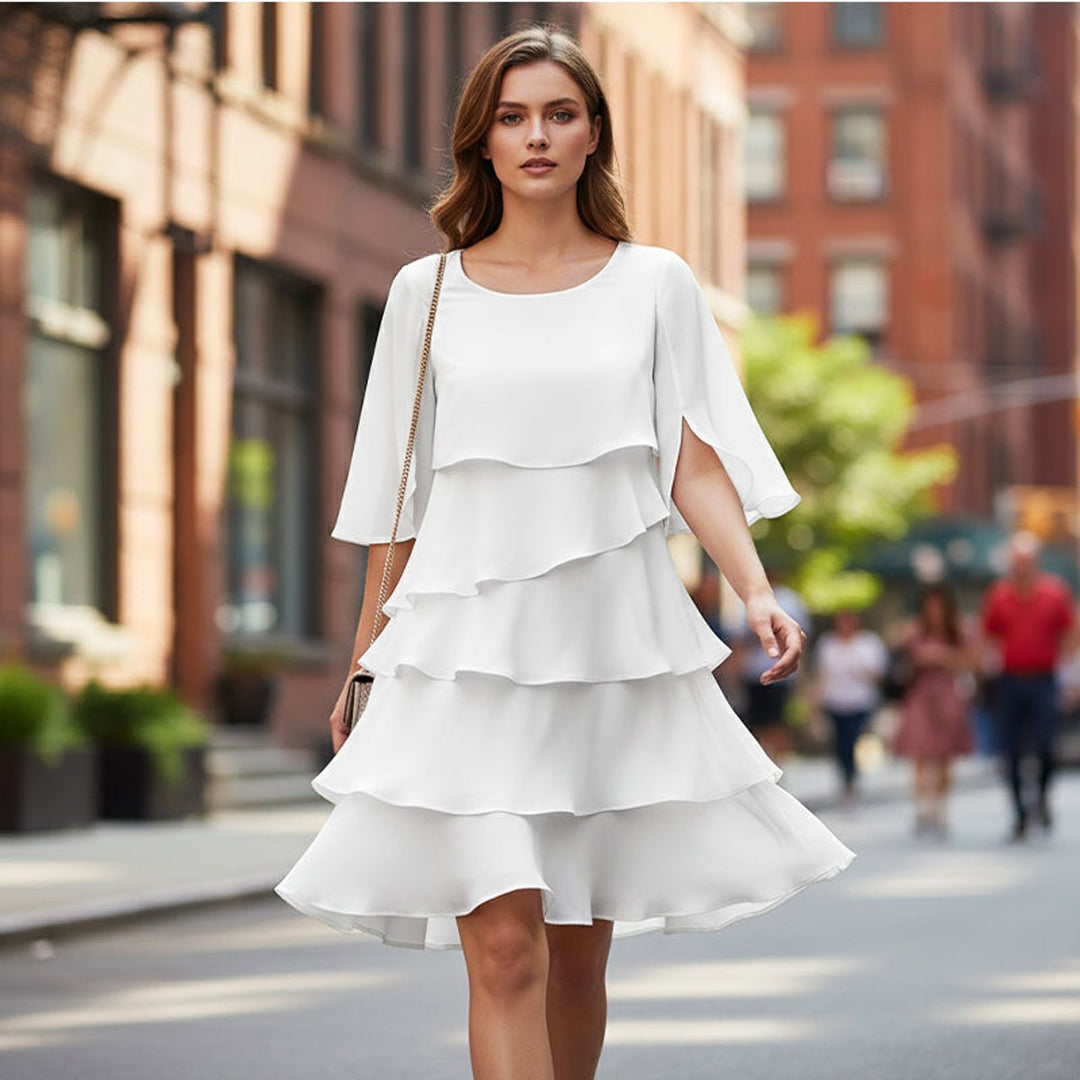 Flowing tiered midi dress with graceful ruffle sleeves, perfect for women.