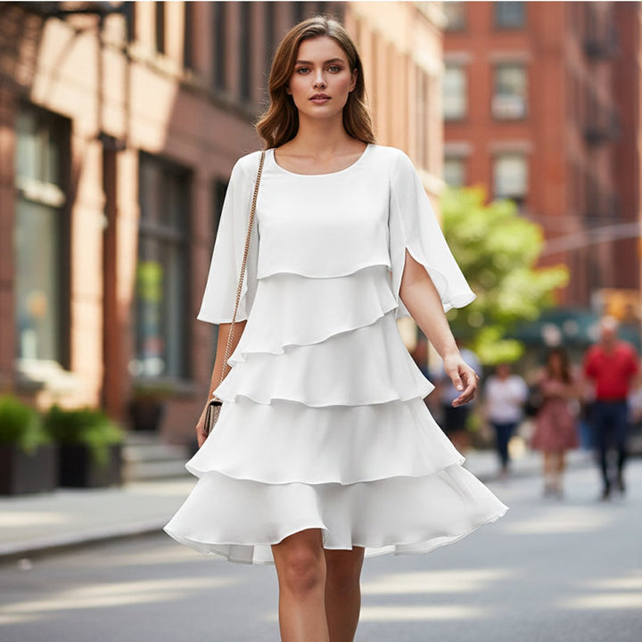 Flowing tiered midi dress with graceful ruffle sleeves, perfect for women.
