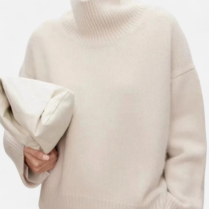 Classic women's turtleneck sweater, a versatile, elegant long-sleeve top for timeless winter fashion.