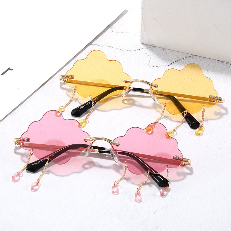 Women's trendy cloud sunglasses with a stylish gold-tone chain. Fashion-forward UV protection eyewear.