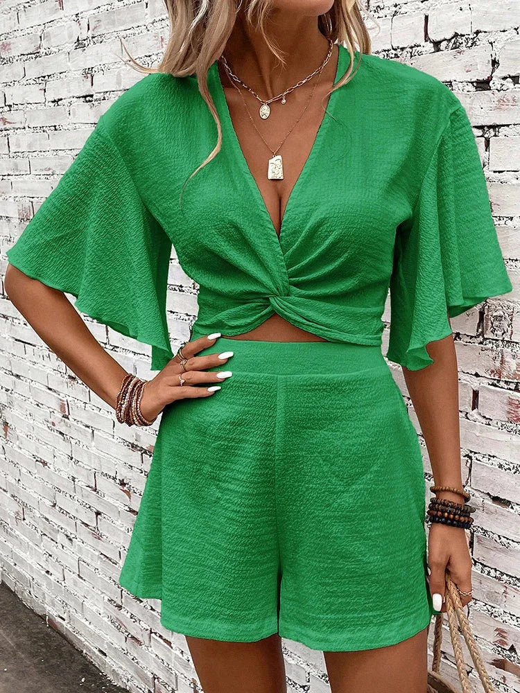 Trendy women's textured V-neck crop top & shorts set, comfortable summer outfit for resort or casual wear.