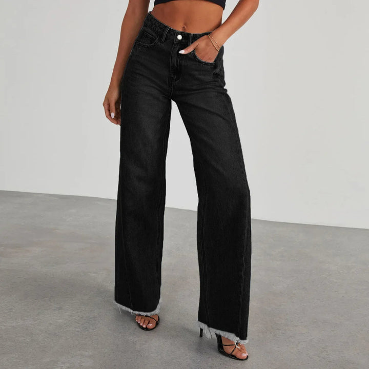 Women's trendy wide-leg jeans with a bold frayed hem, perfect for casual spring and summer street style.