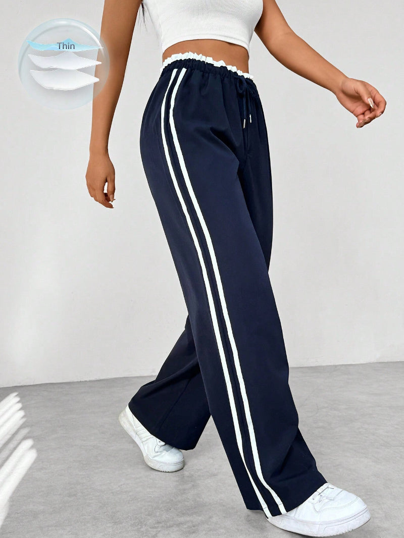 Versatile women's sporty wide-leg pants for comfort & style. High-waist pull-on design ideal for active or casual fashion.