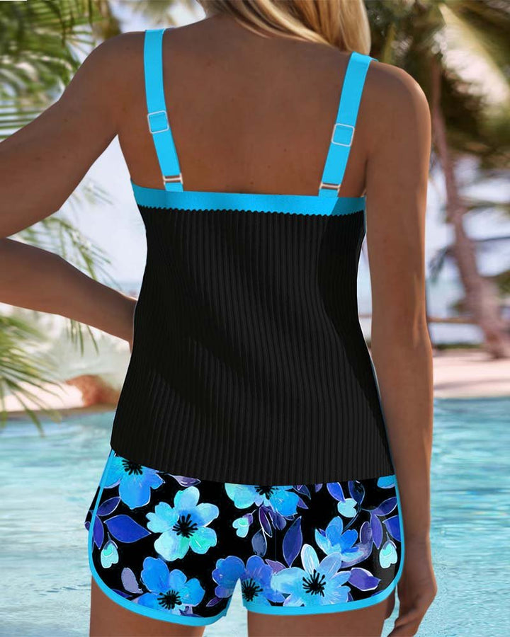 Women's two-piece tankini with intricate floral print. Tummy control design ensures a flattering fit.