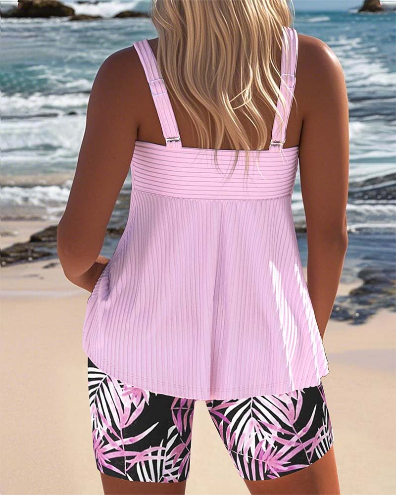Vibrant printed tankini swimsuit set for women. Tummy control two-piece beachwear, perfect for summer.