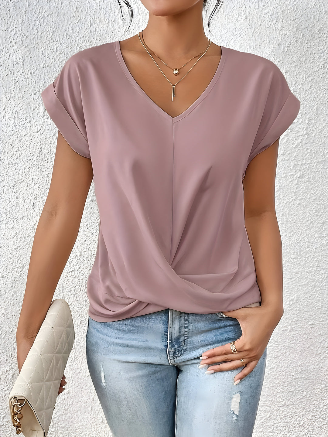 Women's twist front V-neck blouse with short sleeves, a stylish and effortless casual top for everyday wear.