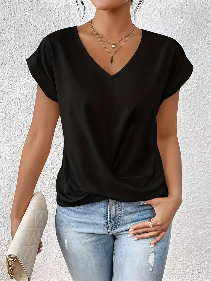 Elegant women's short sleeve V-neck blouse featuring a chic twist front detail, perfect for versatile summer fashion.