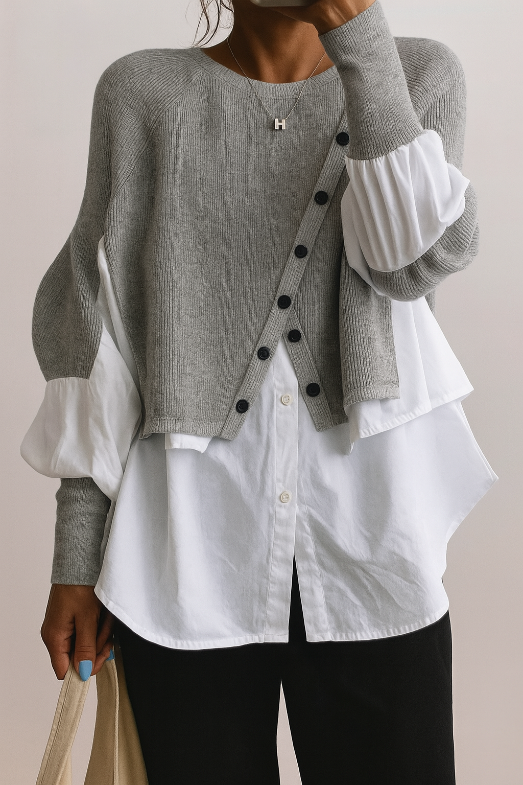Women's two-in-one pullover sweater with a layered blouse hem for a stylish, comfortable & cozy winter look.