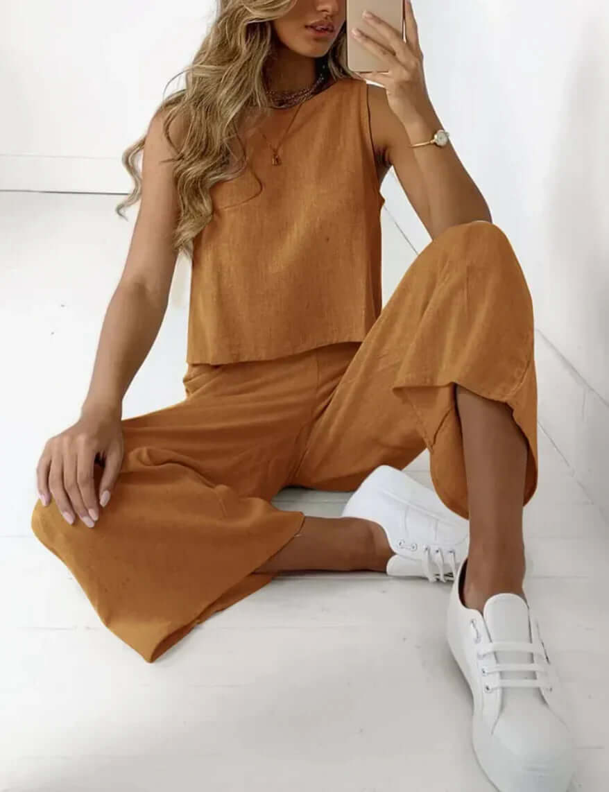 Women's two-piece comfort set in soft fabric, perfect for loungewear or casual wear. Matching top & bottom.
