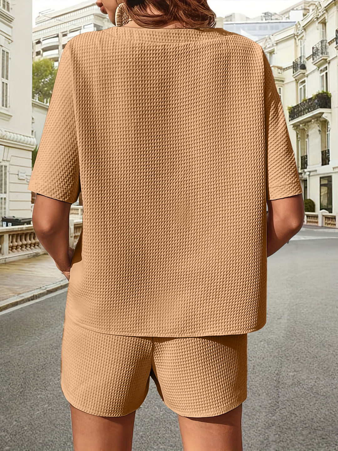 Detail of soft fabric on women's loungewear two-piece set. Comfy summer top & shorts texture.