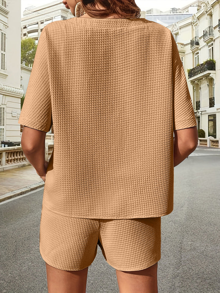 Detail of soft fabric on women's loungewear two-piece set. Comfy summer top & shorts texture.