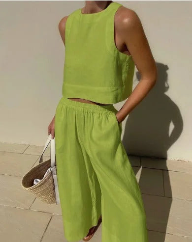 Comfortable women's two-piece set featuring a sleeveless crop top and elastic waist wide-leg pants.