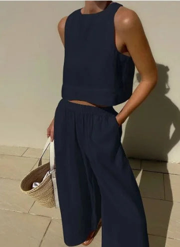 Chic women's two-piece crop top and wide-leg pants set, a versatile summer and vacation fashion statement.