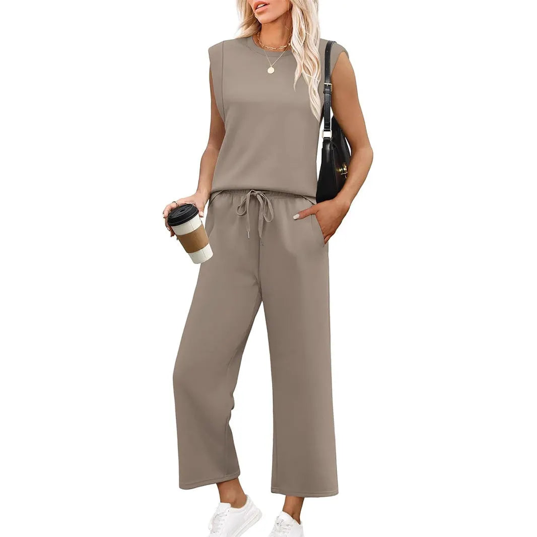 Women's two-piece sleeveless top & wide-leg trouser set. Comfortable, casual elegant summer matching outfit.