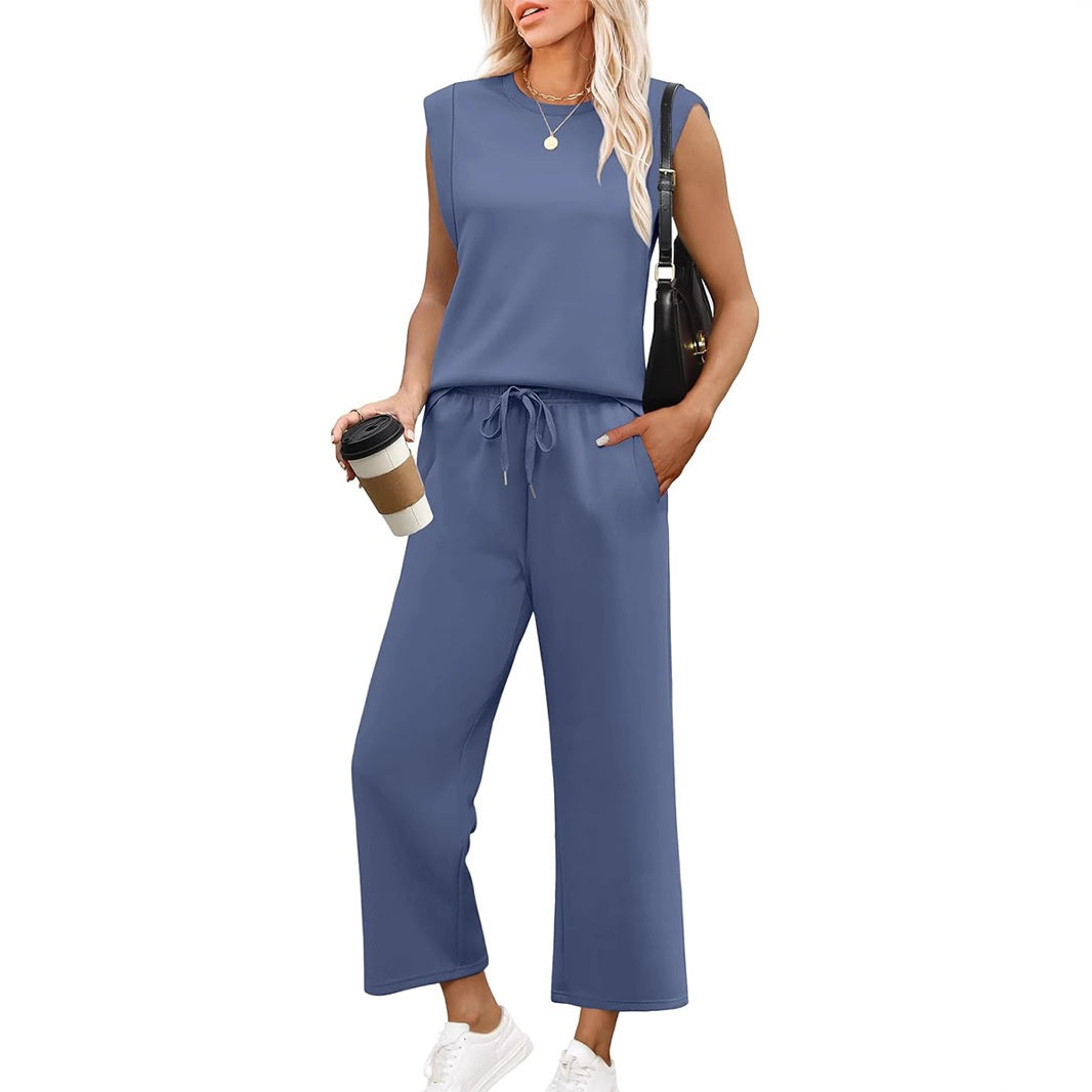 Effortless women's summer style: matching sleeveless top and wide-leg trousers. Comfortable & versatile outfit.