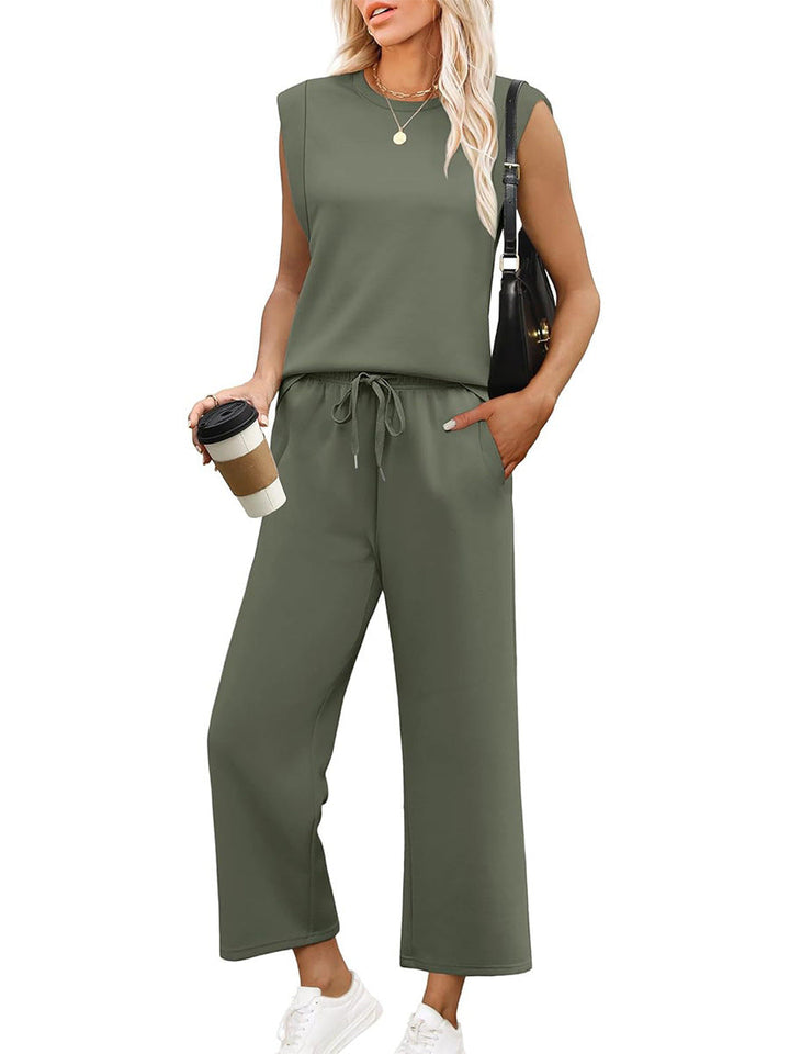 Relaxed women's matching outfit: sleeveless top and wide-leg trousers. Effortless comfort for summer & travel.