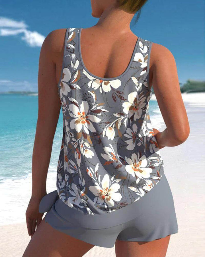 Flattering blue tankini two-piece swimsuit for women. Adjustable top & comfortable fit, perfect for summer beach.