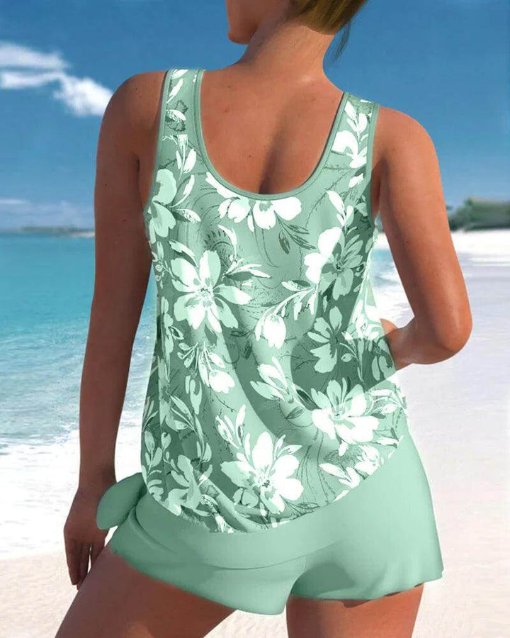 Women's two-piece tankini swimsuit. Comfortable & flattering fit for summer beachwear, available in various colors.