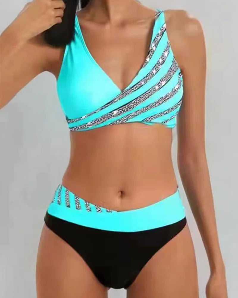 Women's two-tone striped V-neck bikini set with high-waisted bottom, perfect for beach and poolside.