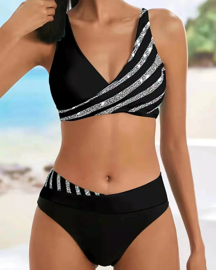 Trendy women's two-piece striped V-neck bikini with comfortable high-waisted bottoms, ideal for resort wear.