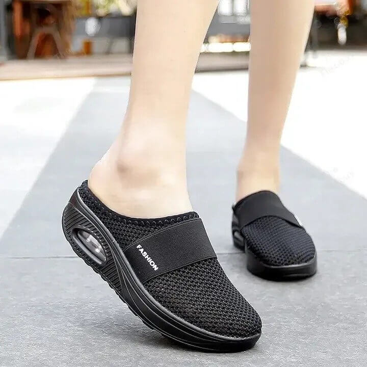 Ergonomic design of women's Ultra Comfort slip-on walking shoes, engineered for natural foot movement and support.
