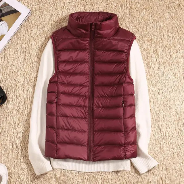 Women's packable down vest. Ultra-light & warm, a perfect puffer vest for on-the-go layering.