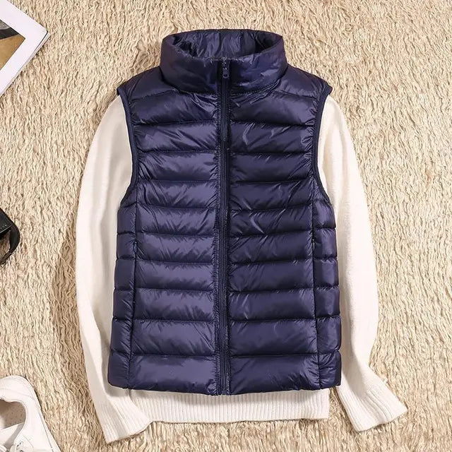 Sleek women's warm vest. Lightweight down puffer, great as a sleeveless jacket for travel.