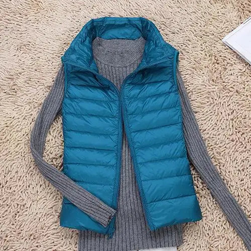 Lightweight women's down vest. Warm puffer vest for casual fashion, ideal outerwear & layering.