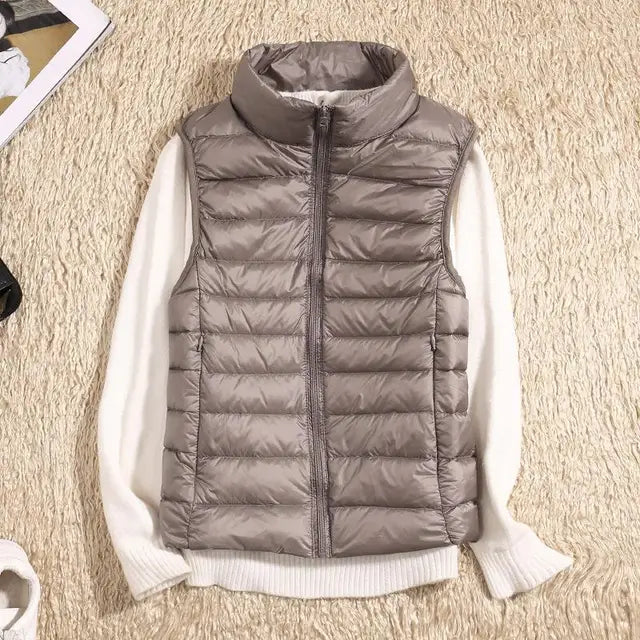 Stylish women's puffer vest. Ultra-light, warm down vest for effortless casual layering.