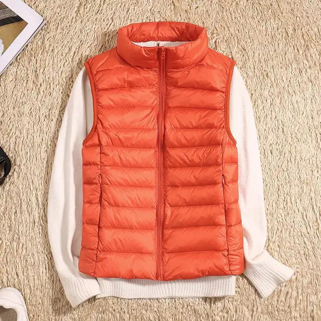 Women's travel-friendly down vest. Ultra-light & warm puffer vest, essential for layering.