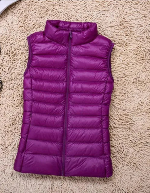 Casual women's lightweight down vest. Warm sleeveless jacket for everyday style & layering.