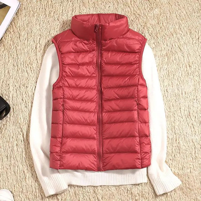Ultra light women's puffer vest. Warm down vest, ideal outerwear for chilly weather layering.