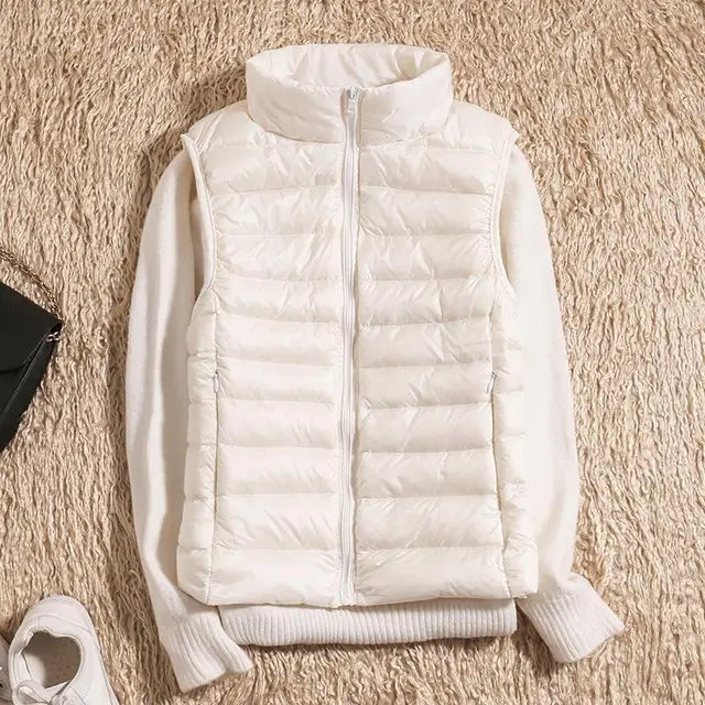 Modern women's down vest. Lightweight, warm sleeveless jacket for versatile casual fashion.