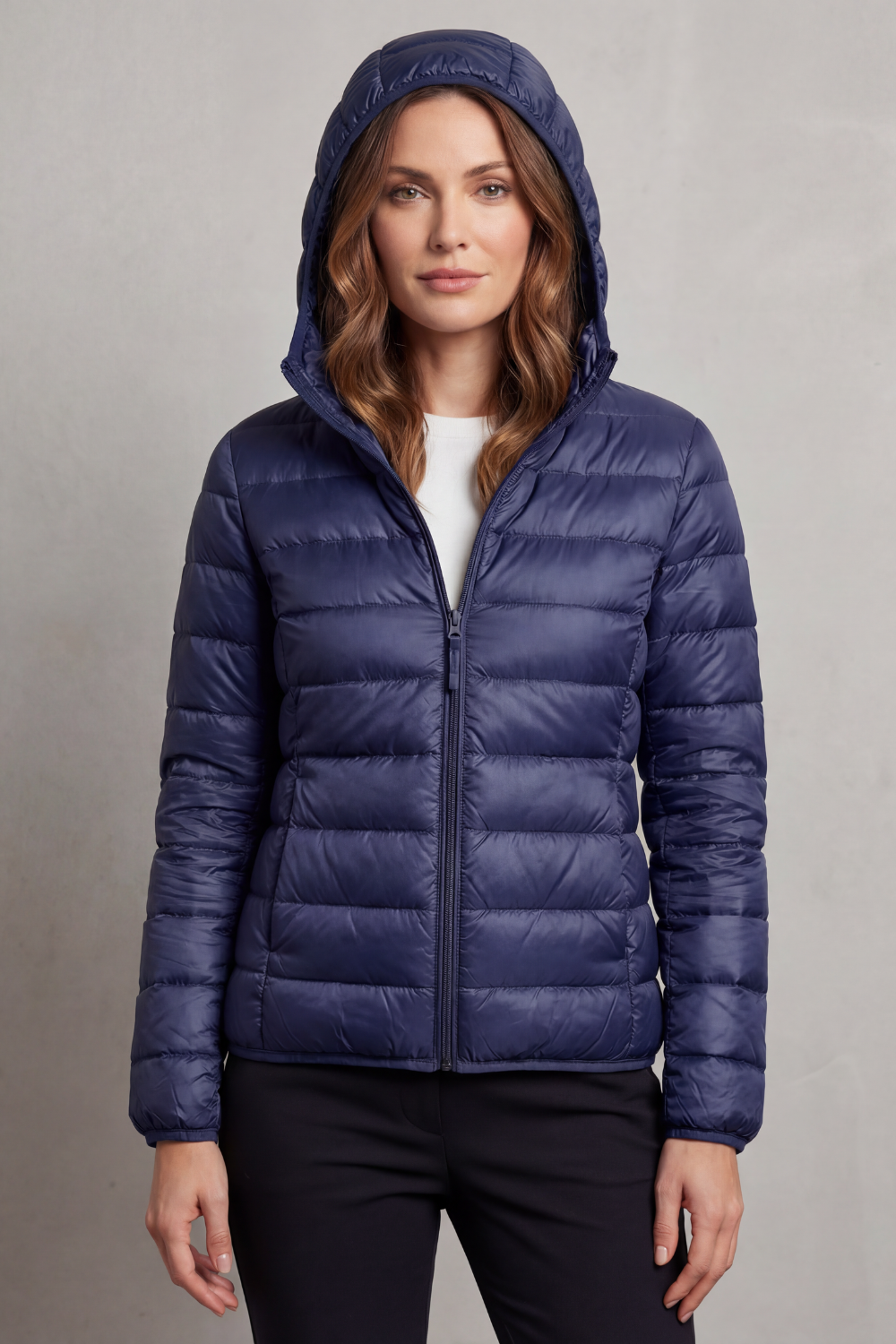 Warm women's ultralight travel jacket, hooded puffer design for easy packing.
