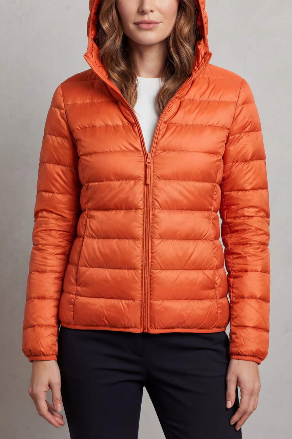 Stylish women's ultralight hooded puffer, a versatile travel coat for cooler days.