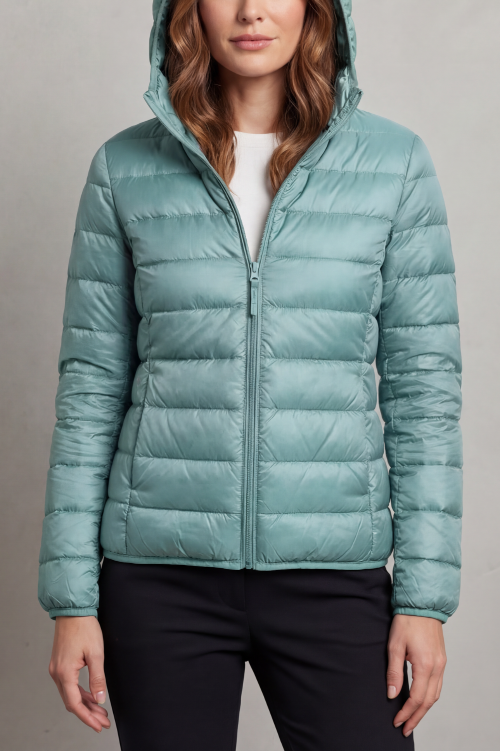 Women's fashionable ultralight hooded puffer, a cozy and packable travel outerwear.