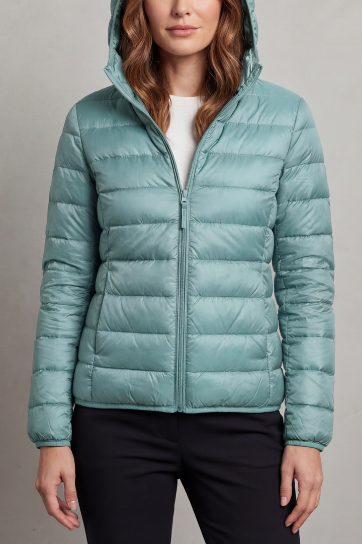 Women's fashionable ultralight hooded puffer, a cozy and packable travel outerwear.