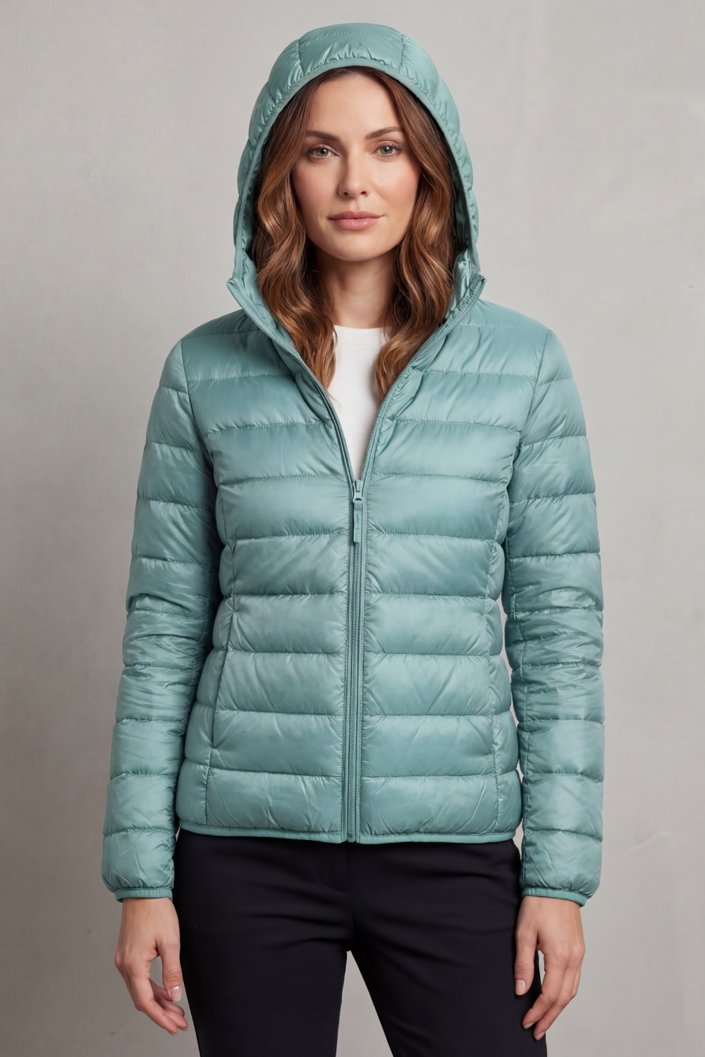 Women's ultralight puffer, hooded and packable, great for cold weather fashion.