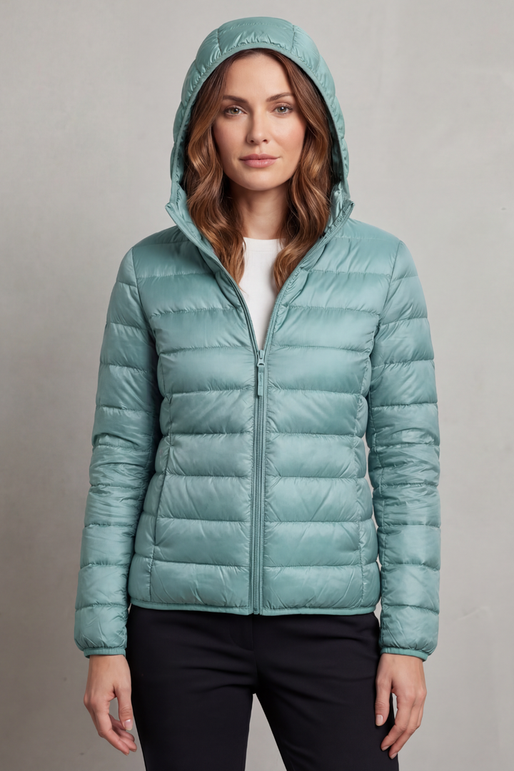 Women's ultralight puffer, hooded and packable, great for cold weather fashion.