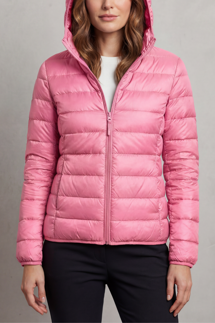 Women's durable ultralight hooded puffer jacket, ideal for travel and outdoor wear.