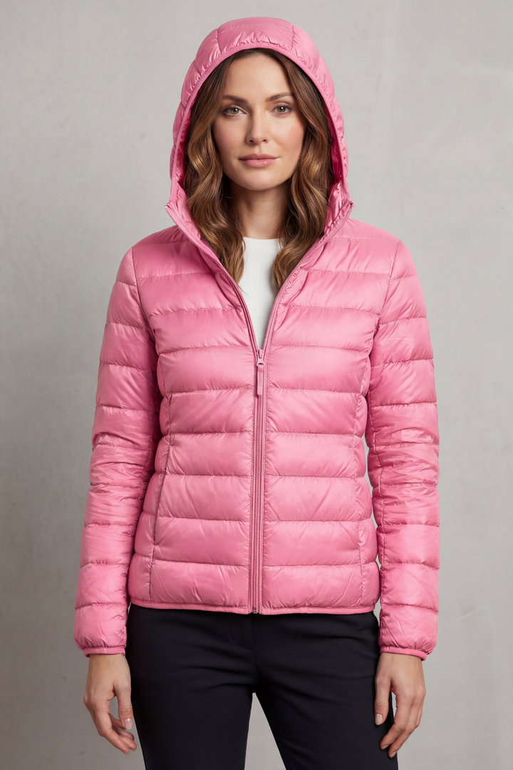 Fashion-forward women's hooded puffer, ultralight & packable for chilly weather.