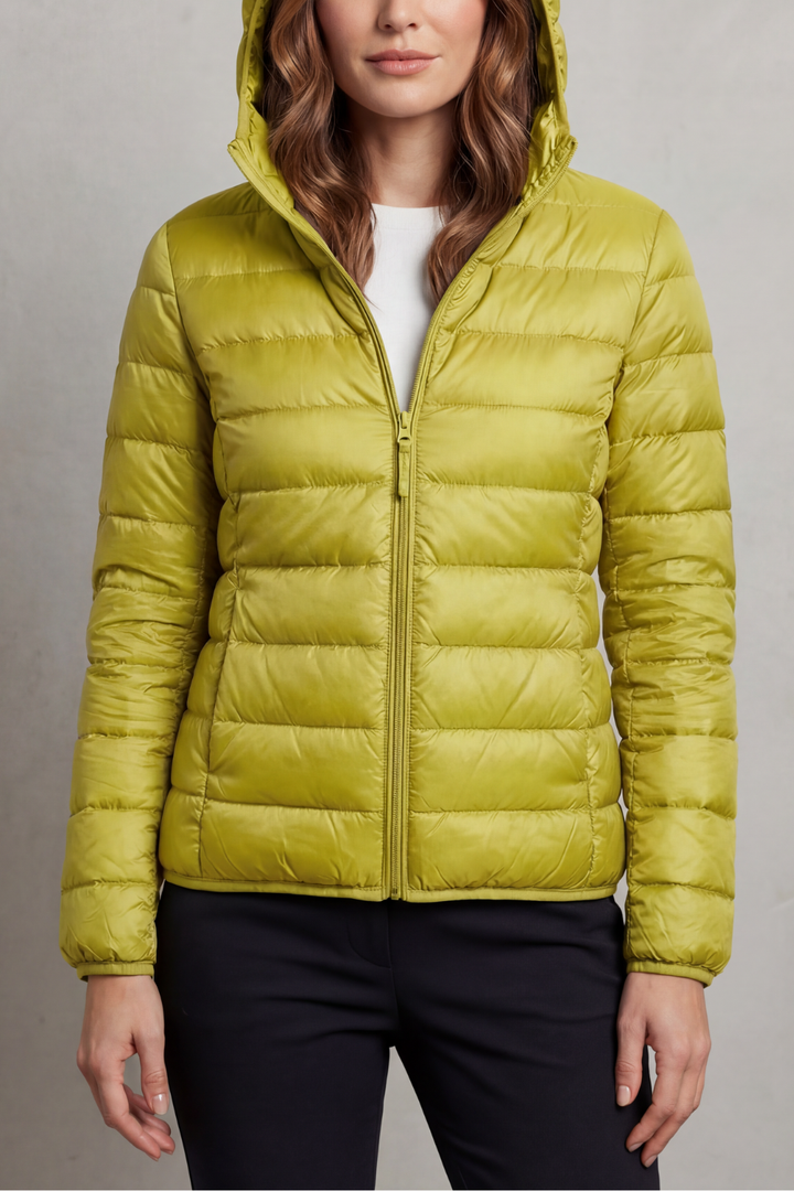 Women's warm, ultralight packable hooded puffer jacket, essential for travel.