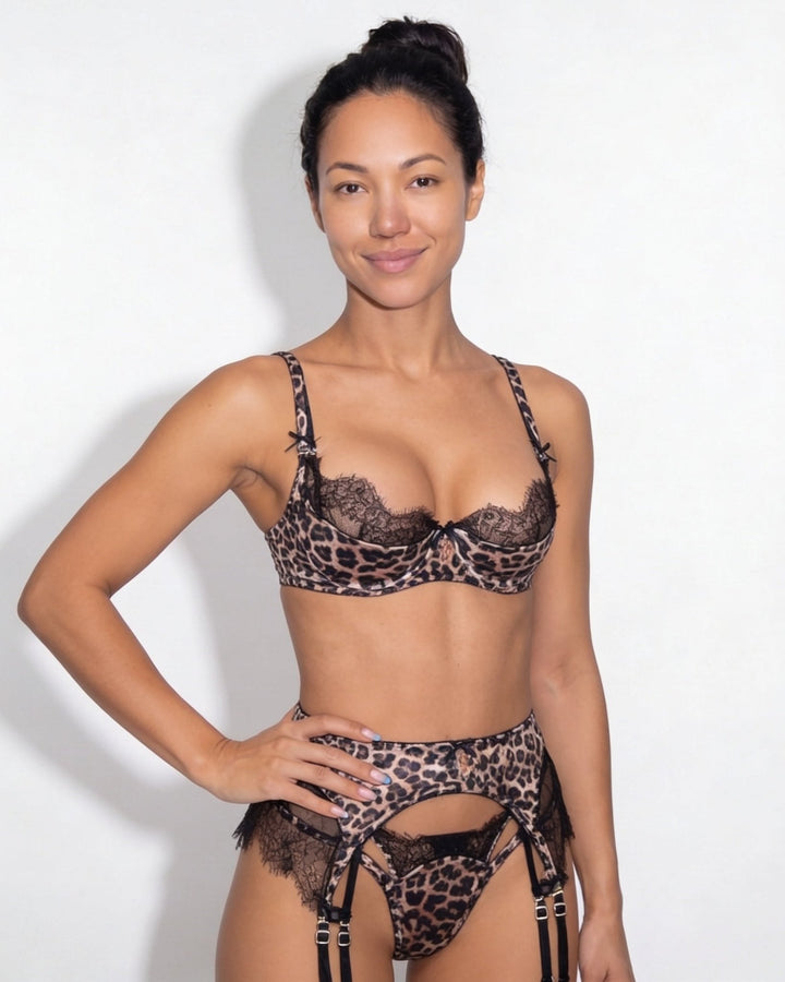 Underwired leopard print bra and black lace lingerie set with matching garter belt, thong, and stockings for women.