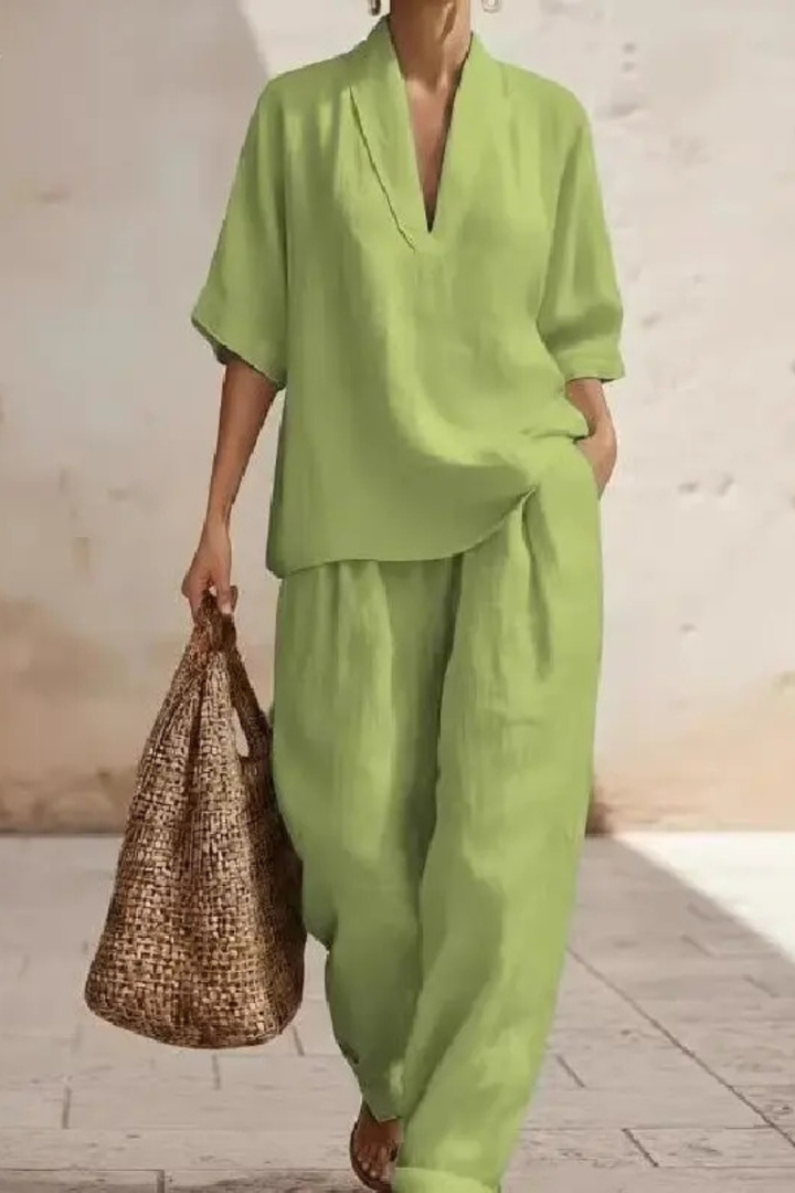 Stylish women's V-neck co-ord set with comfortable wide leg trousers. Ideal for relaxed elegance.