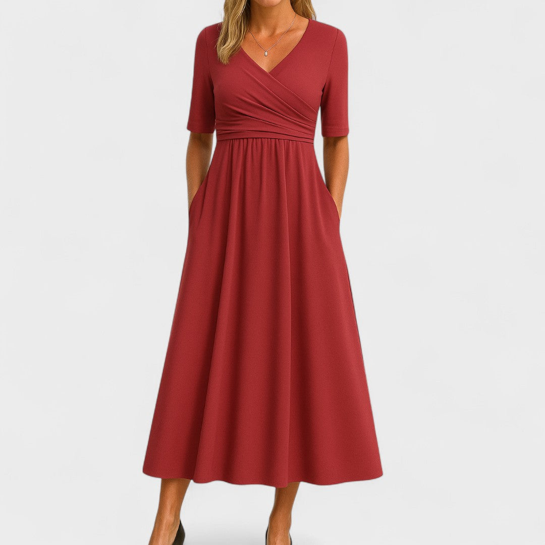 Solid color women's V-neck A-line midi dress. A flattering and comfortable everyday dress with essential pockets.