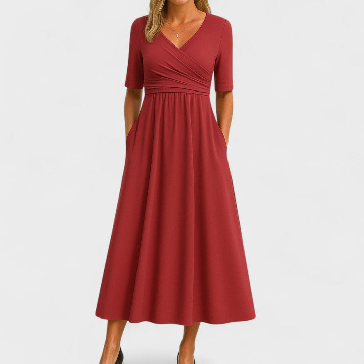 Solid color women's V-neck A-line midi dress. A flattering and comfortable everyday dress with essential pockets.