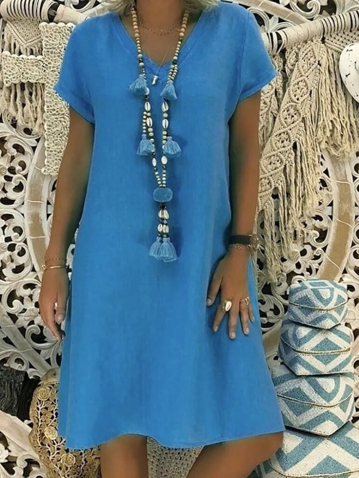 Trendy Women's V-Neck Mini Dress, short sleeve A-line cut. Perfect for casual summer style.