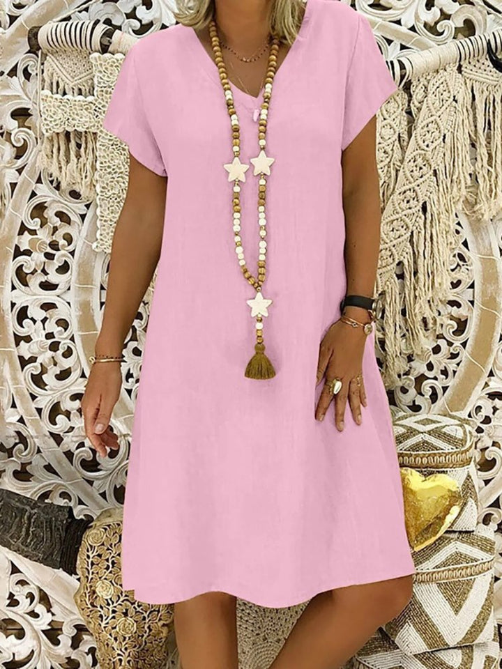 Vibrant Yellow Women's V-Neck A-Line Mini Dress. Short sleeve design, ideal for summer casual wear.